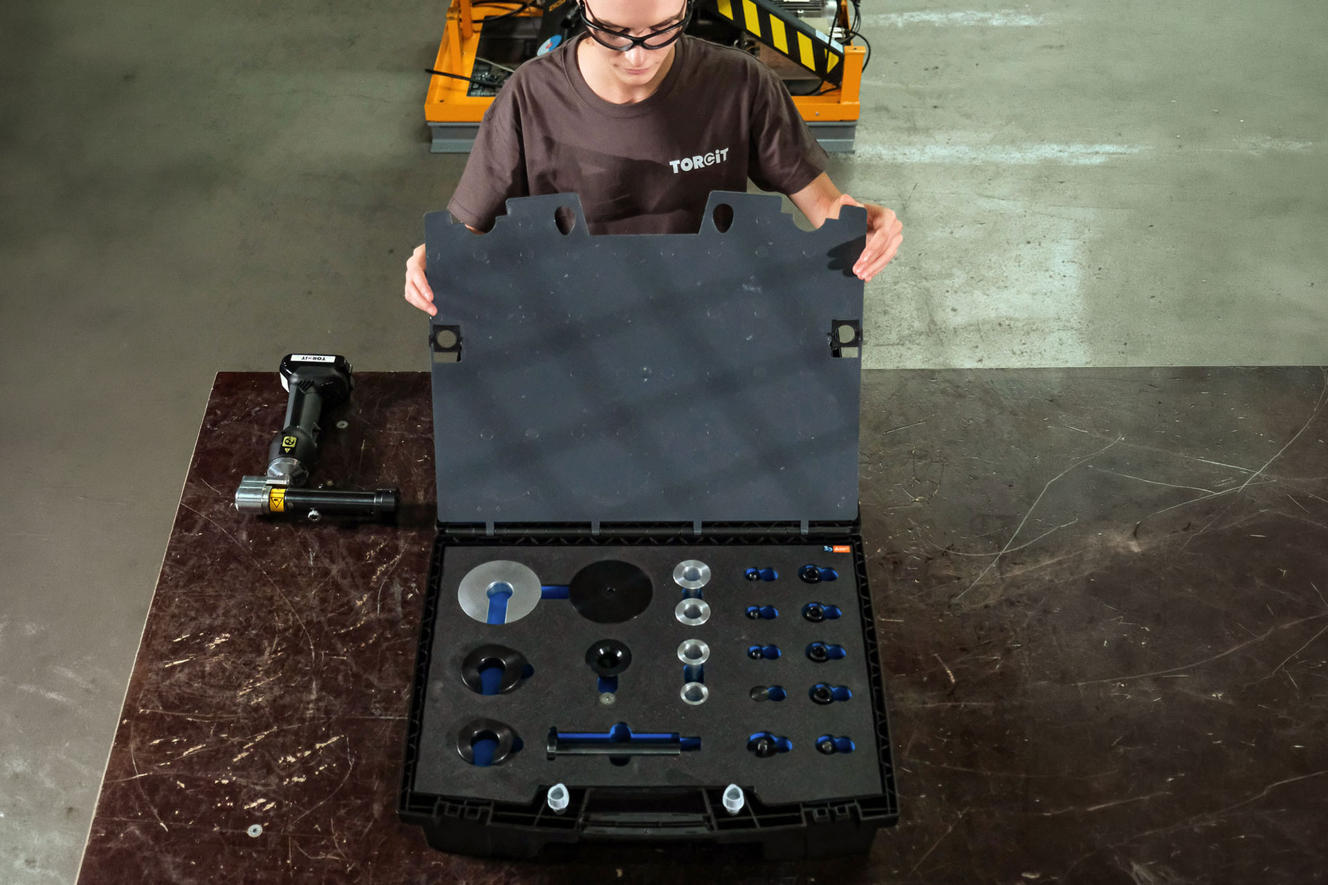 Woman using bearing press tool to install bearing